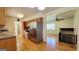 Eat-in kitchen with wood cabinets, stainless steel appliances, and hardwood floors at 1527 Patricia Dr, Morrow, GA 30260