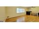 Bright living room with hardwood floors, large window, and ceiling fan at 1527 Patricia Dr, Morrow, GA 30260
