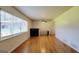 Spacious living room with hardwood floors, bright natural light, and ceiling fan at 1527 Patricia Dr, Morrow, GA 30260