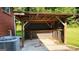 Backyard outdoor cooking area with concrete patio, and a durable metal roof at 1527 Patricia Dr, Morrow, GA 30260