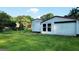 View of a backyard featuring two sheds with ample storage space on a well-maintained lawn at 1527 Patricia Dr, Morrow, GA 30260