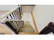 View of the staircase with white risers and black rails that leads to the upper level of the home at 1527 Patricia Dr, Morrow, GA 30260