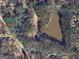 Aerial image displaying property boundaries, showing acreage with pond and road frontage at 6111 Old Monticello Se St, Covington, GA 30014