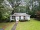 Charming single-story home featuring a well-maintained lawn and inviting front entrance at 6111 Old Monticello Se St, Covington, GA 30014