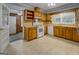 Functional kitchen with ample cabinet space, white appliances, and tile flooring at 6111 Old Monticello Se St, Covington, GA 30014