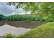 Peaceful lake view framed by green foliage, providing a tranquil setting and natural beauty at 6111 Old Monticello Se St, Covington, GA 30014
