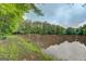Scenic lake view surrounded by lush trees and greenery, offering a serene natural landscape at 6111 Old Monticello Se St, Covington, GA 30014