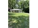 Charming single-story home with a covered porch and a well-manicured lawn at 1597 Joseph E Boone Nw Blvd, Atlanta, GA 30314