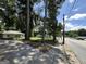 The home's exterior is captured from across the street, highlighting its setting among mature trees at 1597 Joseph E Boone Nw Blvd, Atlanta, GA 30314
