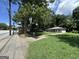The home's exterior with view of the street and neighborhood setting at 1597 Joseph E Boone Nw Blvd, Atlanta, GA 30314