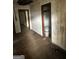 Living room with the paint buckets, looking into other rooms at 1597 Joseph E Boone Nw Blvd, Atlanta, GA 30314