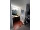 Bathroom vanity with granite countertops, lighting and view into separate tub/shower at 3523 Lehigh Way, Decatur, GA 30034