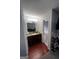Bathroom vanity with granite countertops, lighting and view into separate tub/shower at 3523 Lehigh Way, Decatur, GA 30034