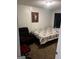 Cozy bedroom featuring a comfortable bed, recliner, and decorative artwork at 3523 Lehigh Way, Decatur, GA 30034