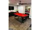Spacious game room featuring a pool table, TV, game machine, and unique flooring at 3523 Lehigh Way, Decatur, GA 30034