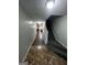 Hallway with tile and carpet flooring, leading to a room with a pool table and a stairway at 3523 Lehigh Way, Decatur, GA 30034