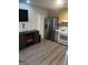 Updated kitchen with stainless steel appliances, light wood cabinets, and a fireplace at 3523 Lehigh Way, Decatur, GA 30034