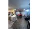 Open living area with a pool table, comfortable seating, and kitchen area at 3523 Lehigh Way, Decatur, GA 30034