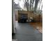 Outdoor patio area features a wooden deck, a grill, a basketball hoop, and a privacy fence at 3523 Lehigh Way, Decatur, GA 30034