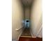 Stairway with carpeted steps and a handrail, leading from dark hardwood floors to an upper level at 3523 Lehigh Way, Decatur, GA 30034