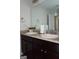 Bathroom featuring a double sink vanity with dark cabinets and granite countertop at 11096 Cornerstone Way, Hampton, GA 30228