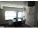 The dining area showcases a modern light fixture and flows into the open-concept living area at 11096 Cornerstone Way, Hampton, GA 30228