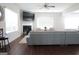 Bright and airy living room with hardwood floors, a fireplace, and a large sectional sofa at 11096 Cornerstone Way, Hampton, GA 30228