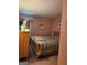 Cozy bedroom featuring a wooden bed frame, matching dresser, and soft natural light at 620 Ashton Ln, Lawrenceville, GA 30044