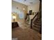 Inviting entryway with neutral tones, features a staircase and a coat rack for added convenience at 620 Ashton Ln, Lawrenceville, GA 30044