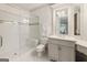 Bathroom featuring a step in shower, tile flooring, and classic white toilet and sink at 4874 Kettle River Pt, Suwanee, GA 30024