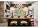 Living room featuring wood beams, stone fireplace, hardwood floors and natural light at 4874 Kettle River Pt, Suwanee, GA 30024