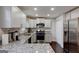 Well-lit kitchen featuring granite countertops, modern appliances, and ample cabinet space at 130 Mount Zion Sw Rd, Atlanta, GA 30354
