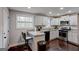 Modern kitchen with stainless steel appliances, granite countertops, and a convenient breakfast bar at 130 Mount Zion Sw Rd, Atlanta, GA 30354