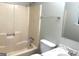 Standard bathroom featuring a bathtub, toilet, single sink vanity, mirror and towel bar at 3589 Burlingham Dr, Lithonia, GA 30038