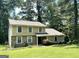 Charming two-story home with a stone facade, inviting curb appeal, and lush landscaping, ready for new owners at 3589 Burlingham Dr, Lithonia, GA 30038
