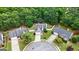Aerial shot of homes with manicured lawns and mature trees in a quiet neighborhood at 320 Cloverwood Drive, Fayetteville, GA 30215