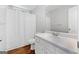 Cozy bathroom featuring a shower with a curtain and a vanity with a mirror at 320 Cloverwood Drive, Fayetteville, GA 30215