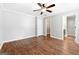 Spacious bedroom featuring a ceiling fan, neutral paint color, walk-in closet, and attached bathroom at 320 Cloverwood Drive, Fayetteville, GA 30215