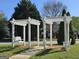 Community space with shade structure featuring hanging swings at 320 Cloverwood Drive, Fayetteville, GA 30215