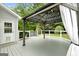 Exterior deck with an overhead cover and railing, great for outdoor gatherings and relaxation at 320 Cloverwood Drive, Fayetteville, GA 30215