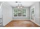 Dining area showcases natural light from a large window, modern light fixture, and a closet at 320 Cloverwood Drive, Fayetteville, GA 30215