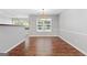 Cozy dining room area featuring hardwood floors and natural light with space to dine at 320 Cloverwood Drive, Fayetteville, GA 30215
