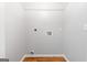 Functional laundry room with connections for washer and dryer on a hard floor at 320 Cloverwood Drive, Fayetteville, GA 30215
