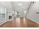 Bright living room with hardwood floors, a fireplace, and easy access to the entryway at 320 Cloverwood Drive, Fayetteville, GA 30215