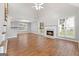 Bright living room with a fireplace, large windows, and an open floor plan at 320 Cloverwood Drive, Fayetteville, GA 30215