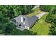 Aerial perspective of home featuring a patio, lush lawn, and mature trees offering shade and enhanced privacy at 315 Antioch Road, Mcdonough, GA 30252