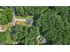 Birds-eye view of a secluded home enveloped by mature trees, offering privacy and a natural, tranquil setting at 315 Antioch Road, Mcdonough, GA 30252