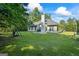 Spacious backyard, showcasing a pristine lawn, patio and the house's exterior at 315 Antioch Road, Mcdonough, GA 30252