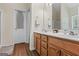 Bright bathroom featuring a double sink vanity with wood cabinets at 315 Antioch Road, Mcdonough, GA 30252
