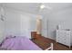 Bedroom with wood floors, neutral walls, ceiling fan, and natural light at 315 Antioch Road, Mcdonough, GA 30252